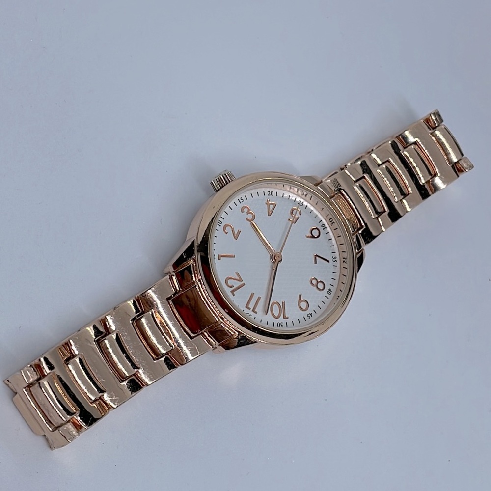 Accutime rose gold watch